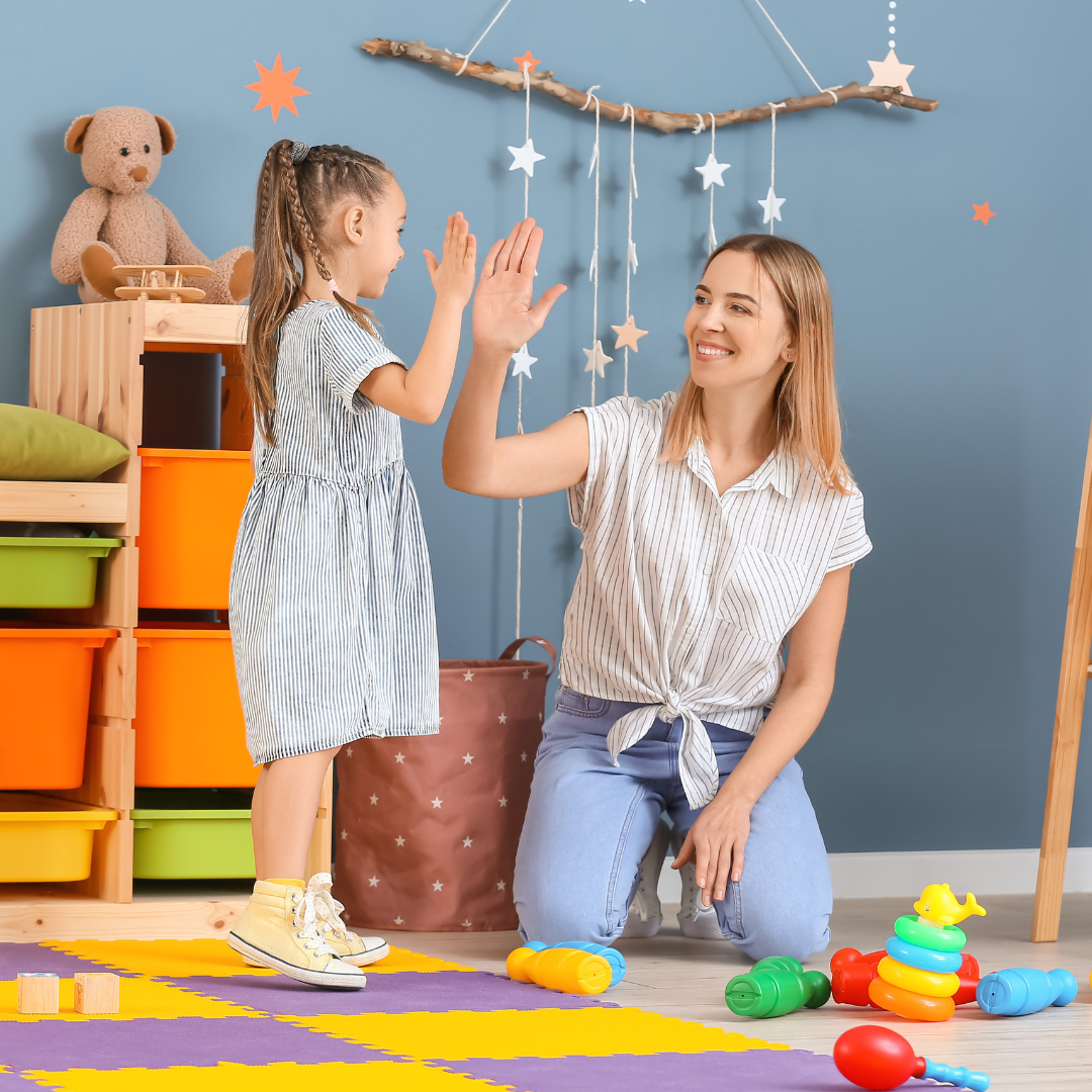 Nanny high five with a child