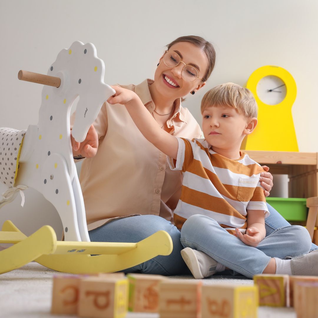 Nanny with a child playing