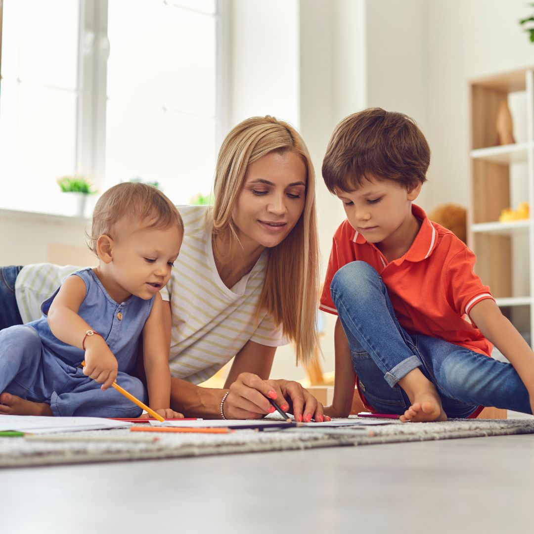 Nanny interacting with two children