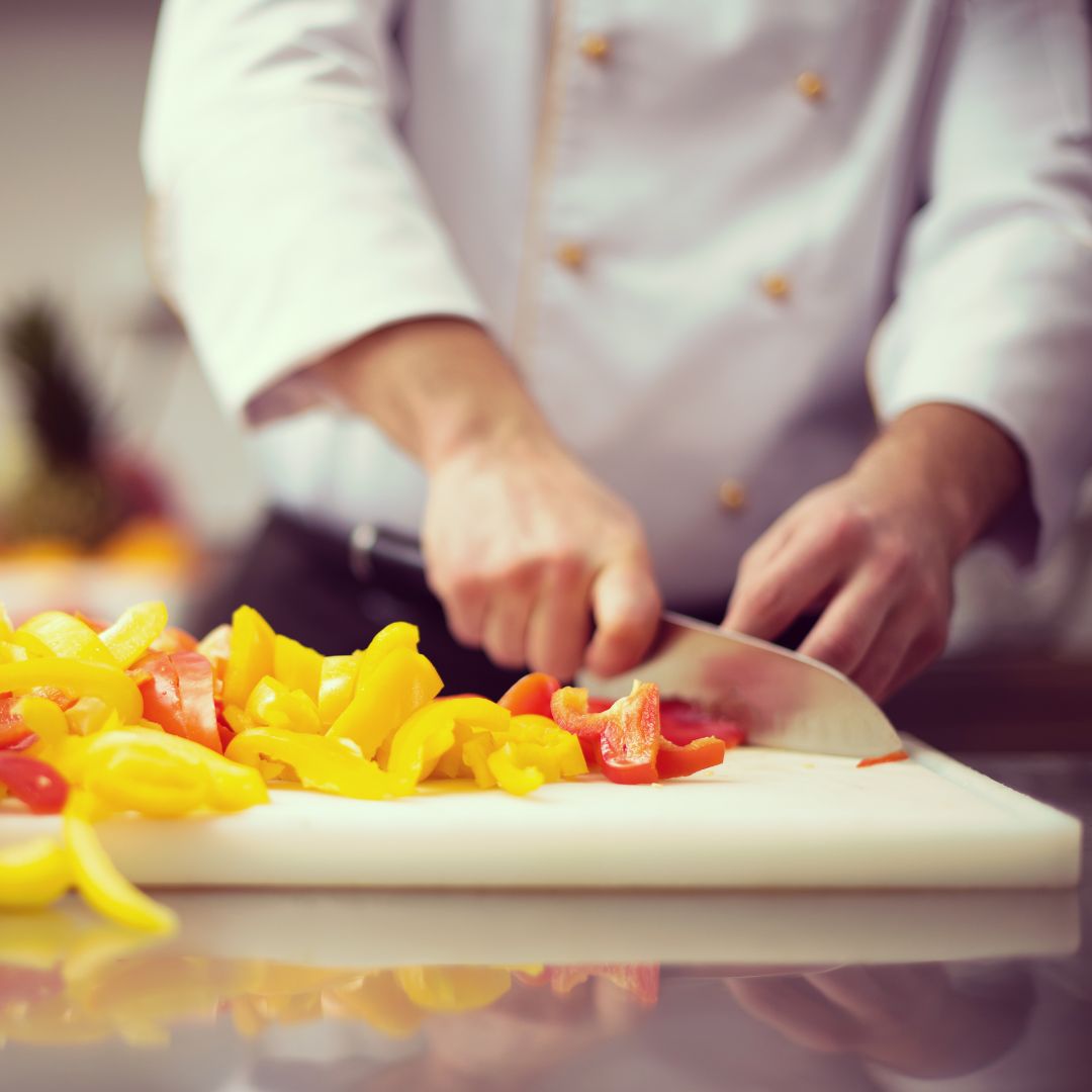 Sports nutrition chef cutting peppers