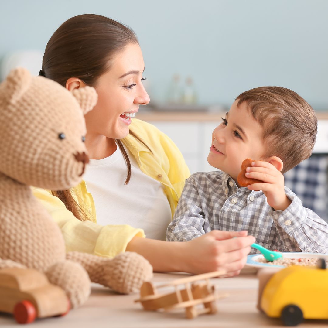 Nanny smiling at toddler