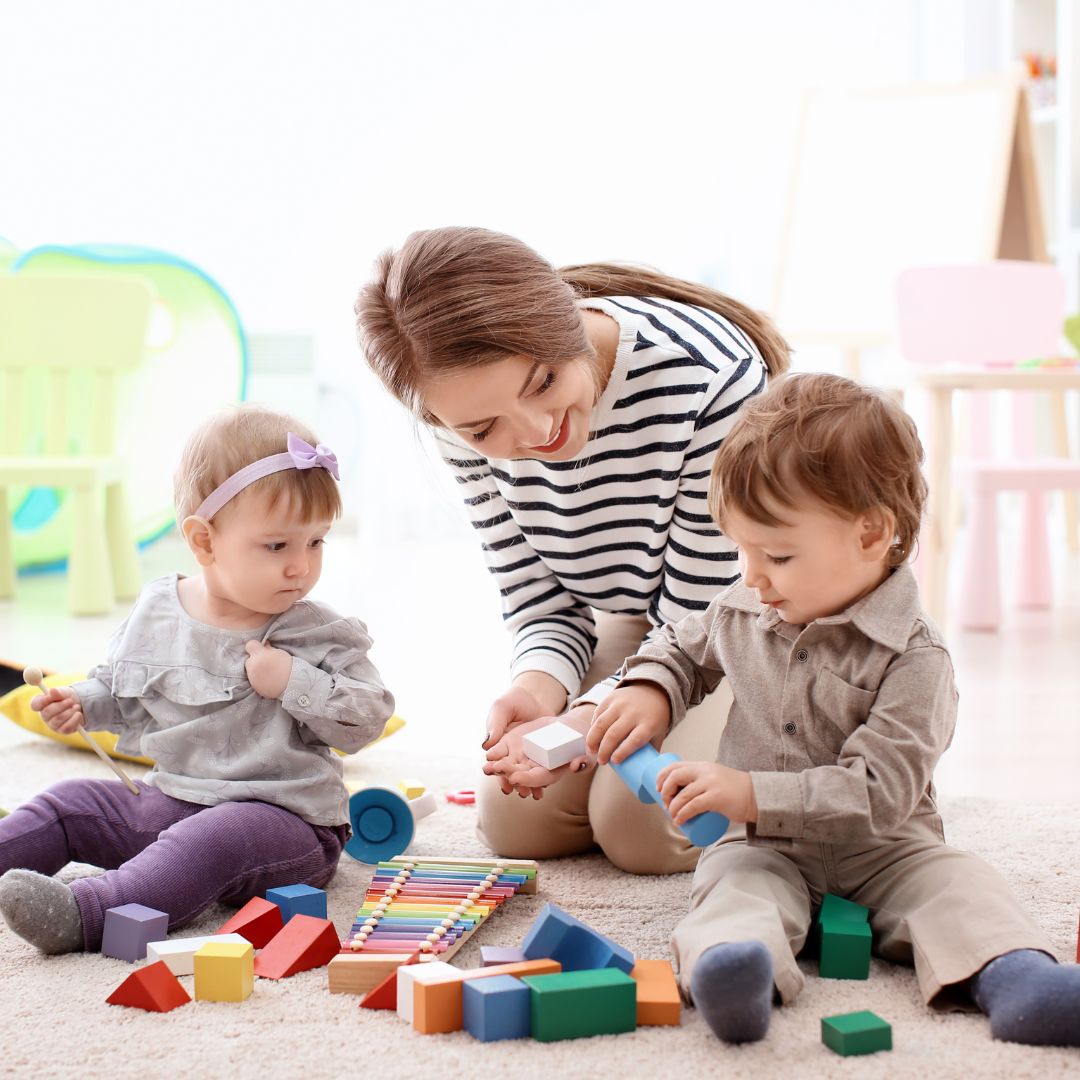 Kensington nanny playing with two children