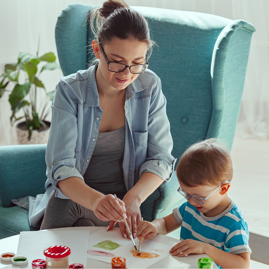 Nanny with a toddler in the living room